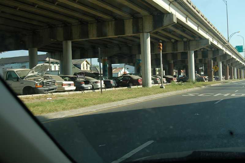 New Orleans 04-08-06 061.JPG - Sunday morning, I drove back to the 9th Ward to take a few more pictures.  The cars stored under the elevated highway (I-10) were damaged by hurricane flooding and have not been claimed.